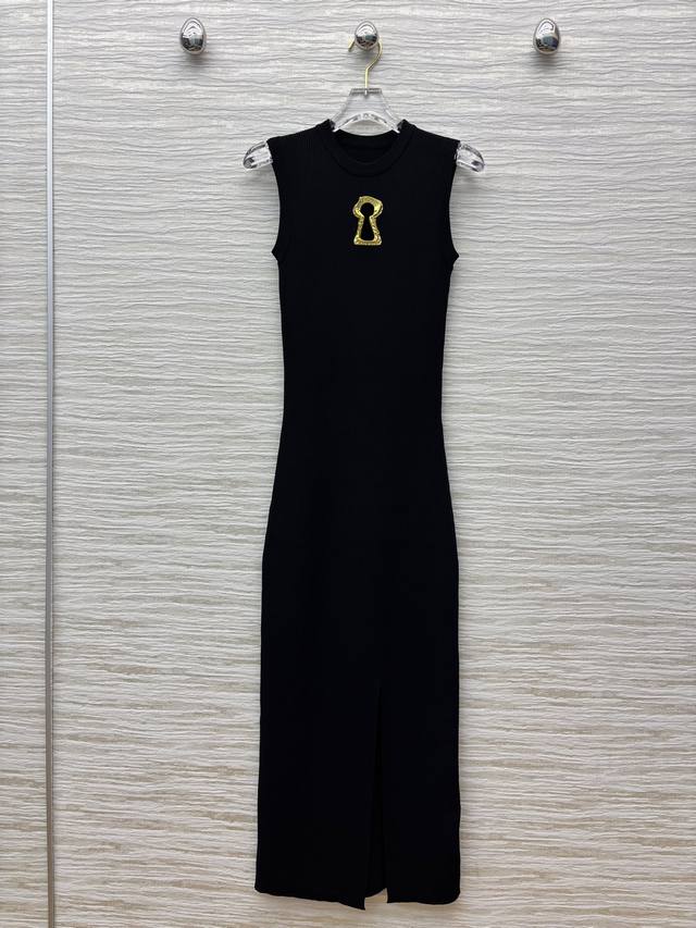 Sch's 25 new sleeveless knitted dress with metal key embellishments. The sleevel