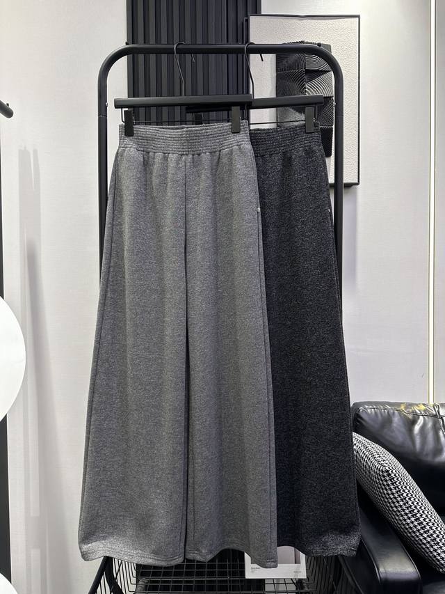 Acne Studios - New high-waisted wide-leg trousers with metallic round plaques. C