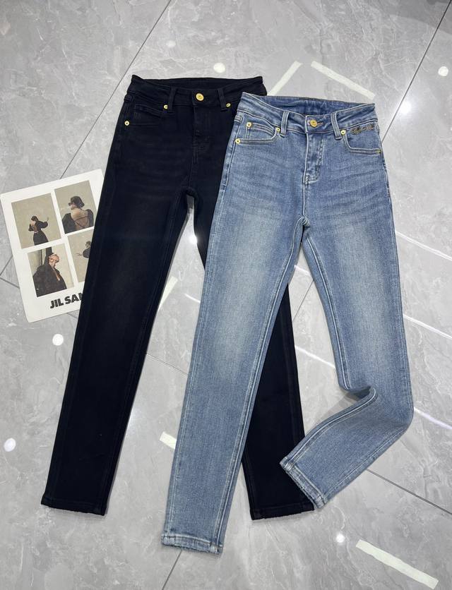 Details shot Balmi*'s latest early autumn floral embroidered logo jeans with ski