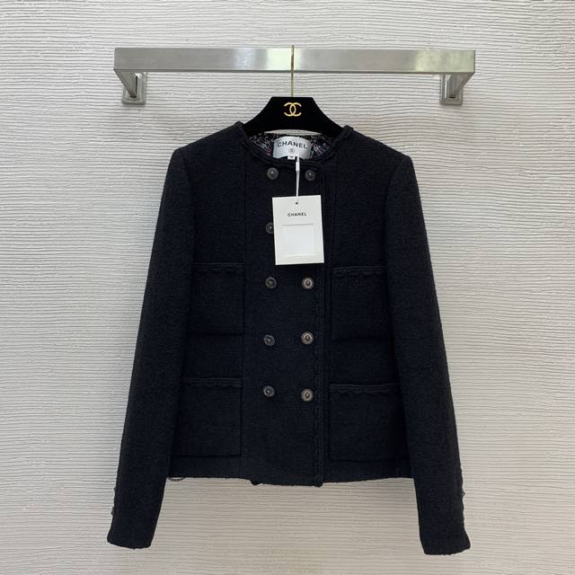 Chane*'s newest Chanel jacket features a custom-made colorful safety pin print l