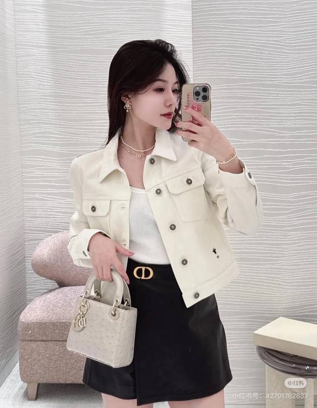 Dio's new high-end custom-made denim jacket features original logo buttons, mono