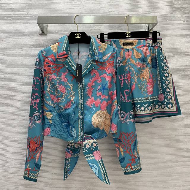Versac's newest starfish and conch shell print two-piece suit for a stylish holi