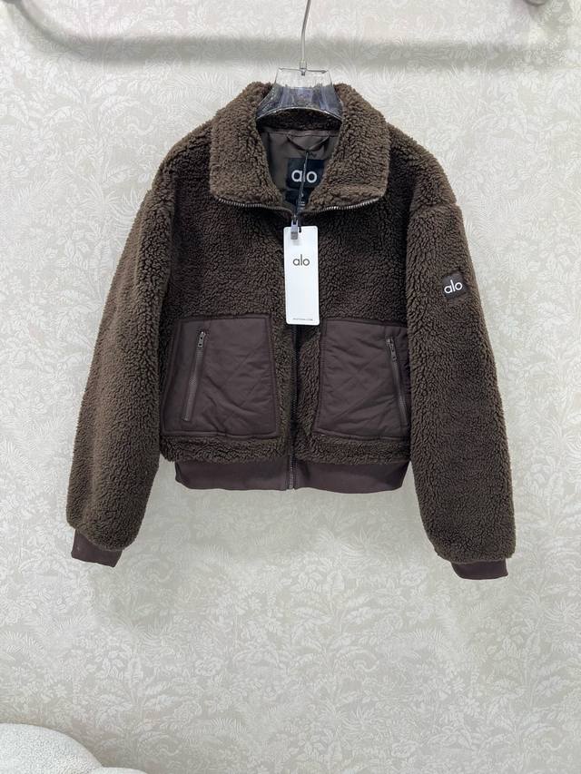 Alo*25's new Teddy plush flight jacket features diamond-quilted panels on the sl