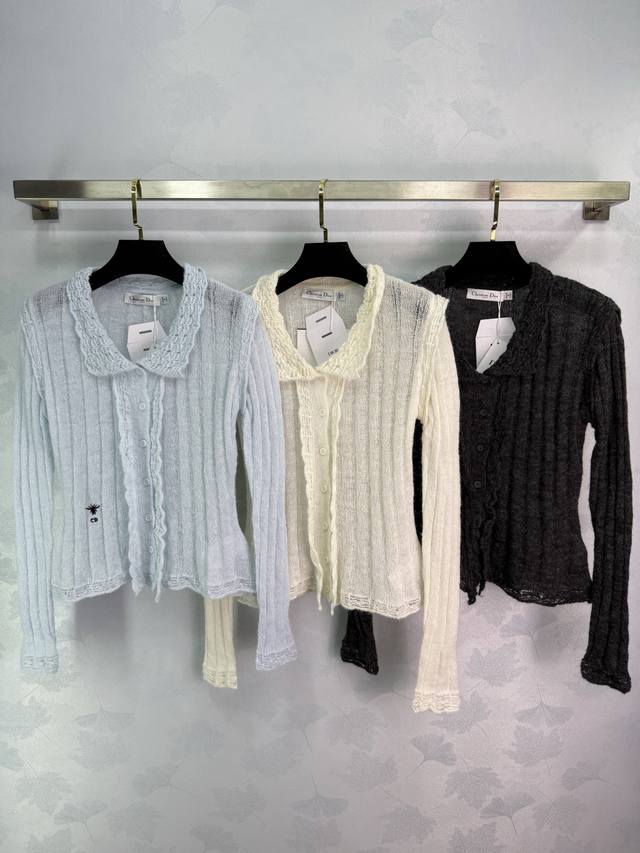 Dio*25's new early fall knitted cardigan features a delicate ruffled neckline an