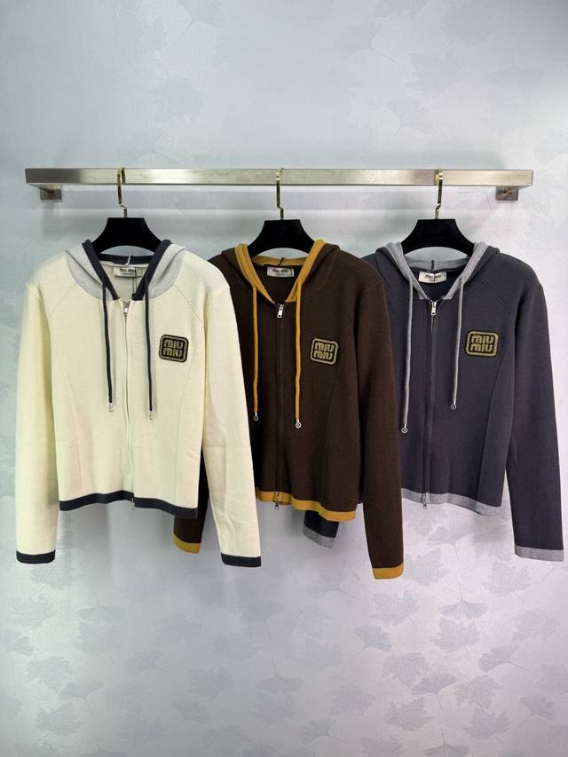Miu*25 new early fall hooded knitted cardigan. The classic Miu M logo is embroid