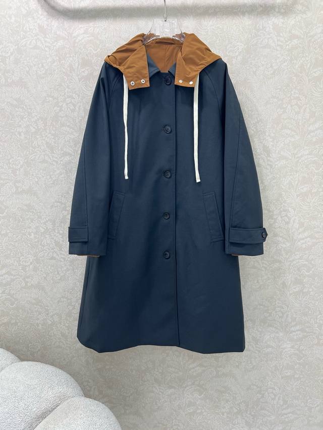 Miumi* 25 new long trench coat with a British-inspired, relaxed fit. Dropped sho