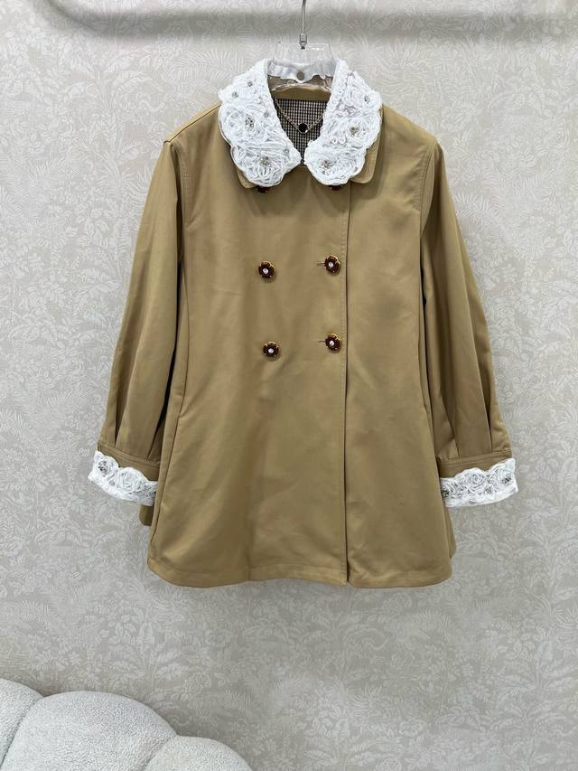 Miumi*25's new early fall trench coat features a double-breasted, custom-made di