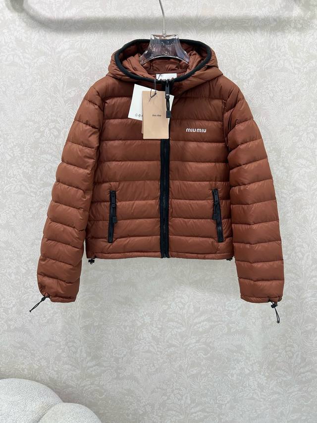 Miumi*25's new hooded down jacket is custom-made from Yb windproof and waterproo
