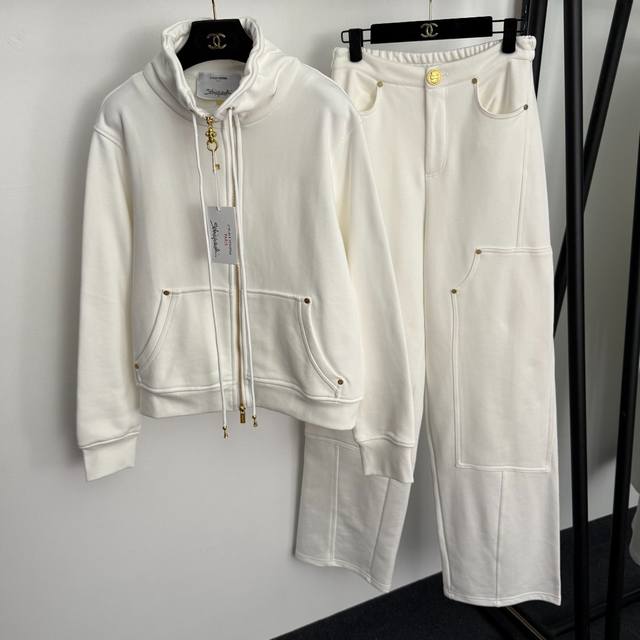 Style No. 20255867 Schiaparelli's latest sports suit, a long-sleeved stand-up c