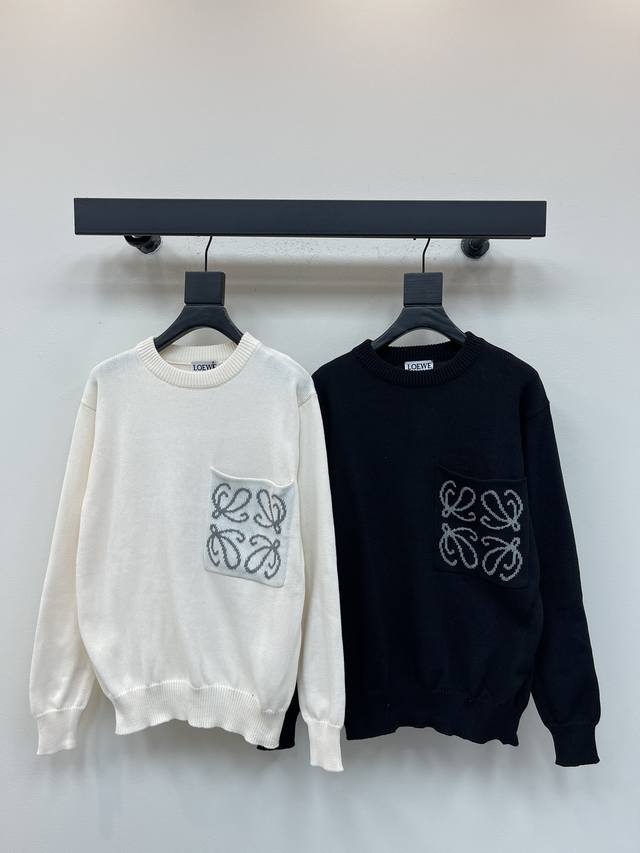 Loew*'s new fall/winter crewneck sweater with large chest pockets and embroidere