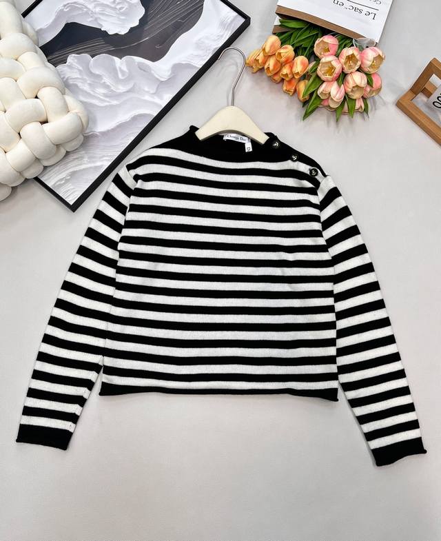 Dior's new early autumn sweater with anchor shoulder buttons and striped letter