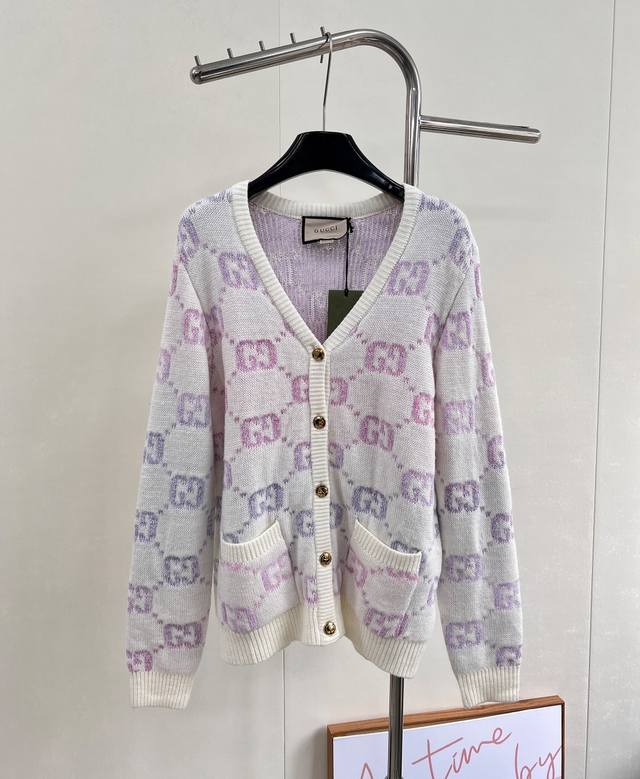 Gucci's Double G monogram intarsia wool cardigan, in a pastel hue, adds a touch