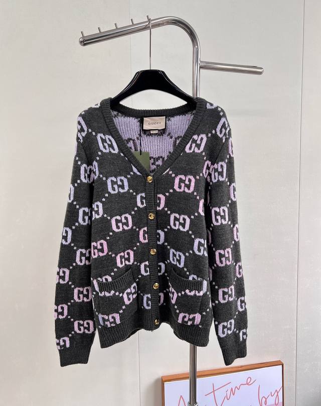 Gucci's Double G monogram intarsia wool cardigan, in a pastel hue, adds a touch