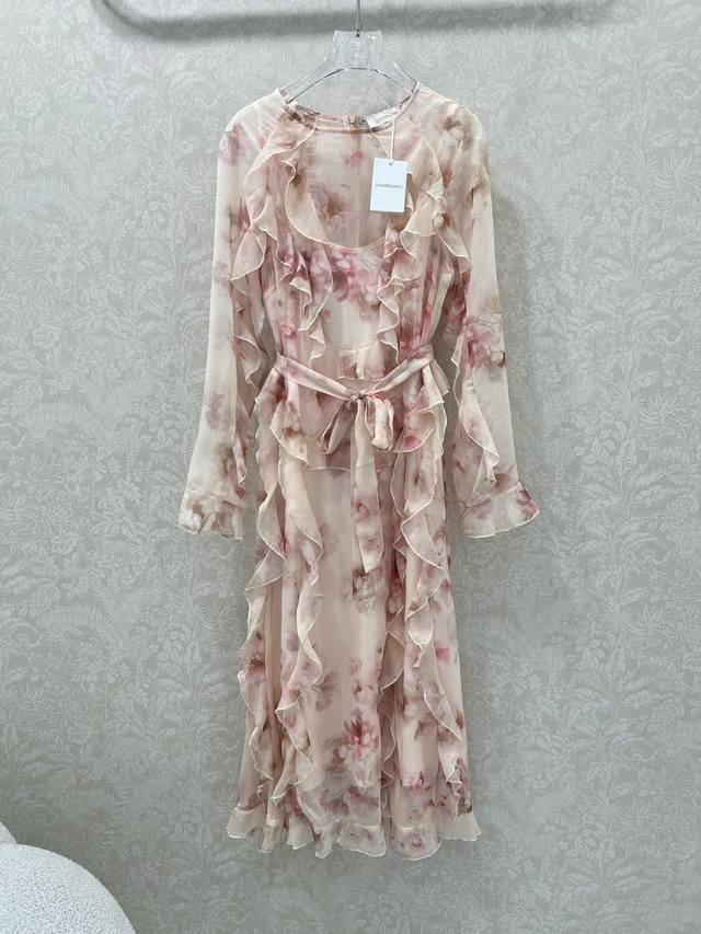 Zimmerman*'s new 2025 dress with ruffled hems and a cinch-waist cinching detail.