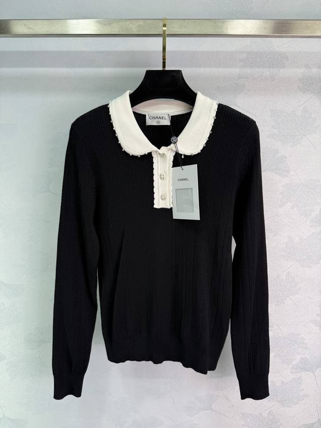 Ch*25 New Early Fall Sweater with a white lapel and pearl embellishment. This si