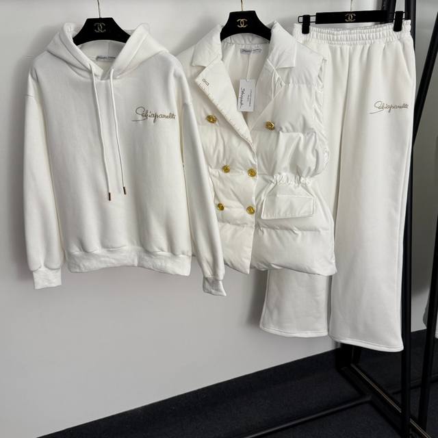 Style No. 20255791 Schiaparelli's latest three-piece warm suit, keyhole gold do