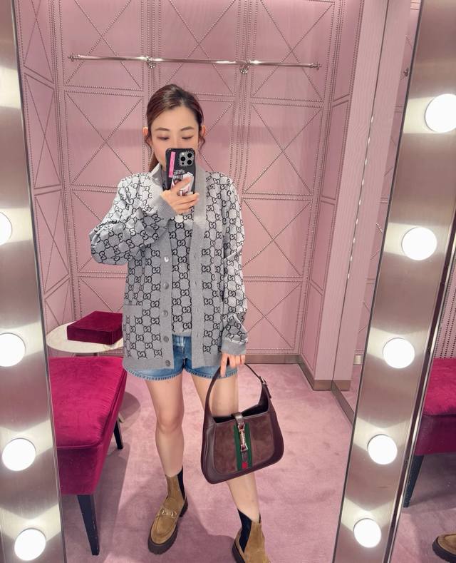 Gucc*25's limited-edition autumn/winter collection features a knitted cardigan w