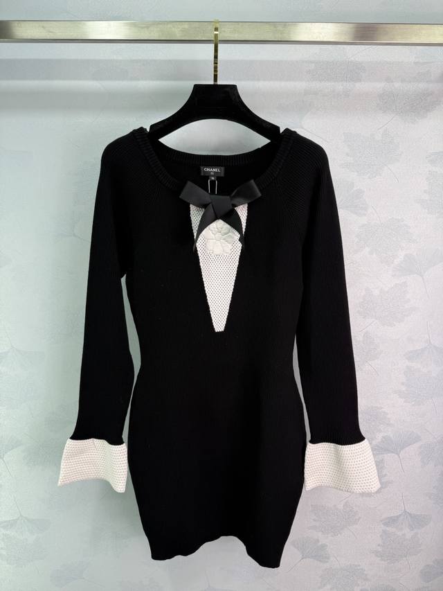 Ch*25B Black knitted dress with white hollow bow design. Black body with white h