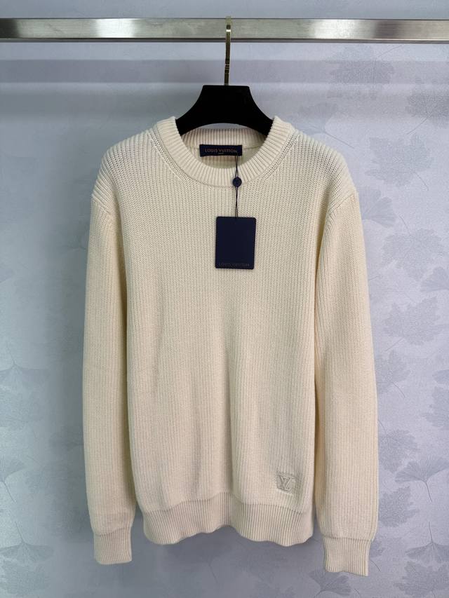 Lou*25's new early fall crew-neck knit sweater features a classic embroidered lo