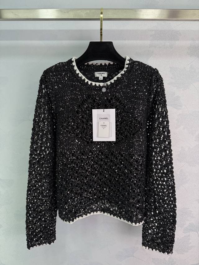 Chane* Black sequined knit top with a round neckline and white lace trim. The do