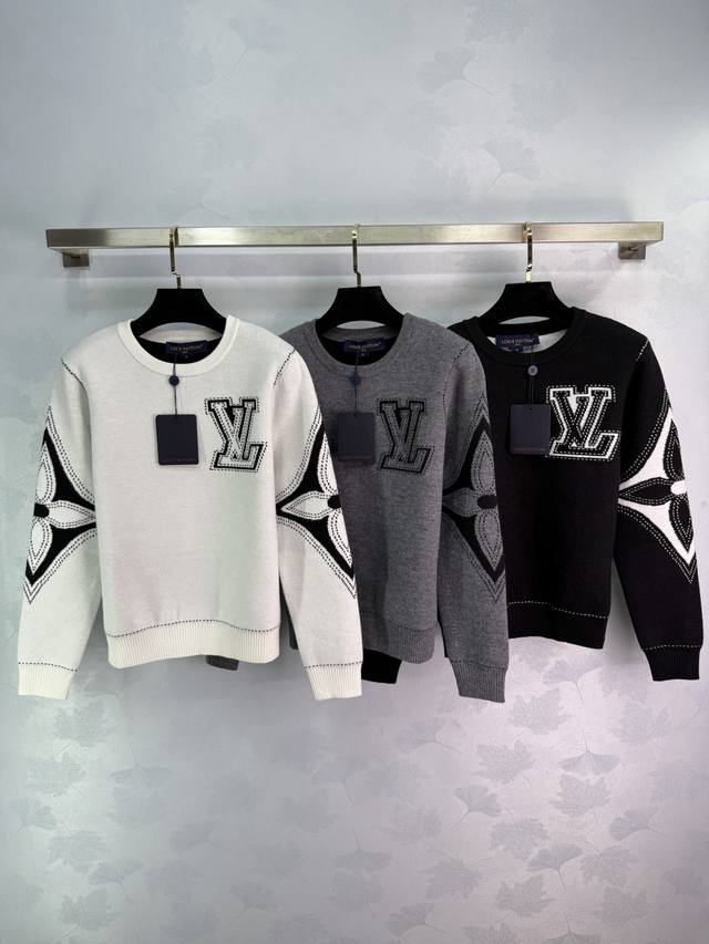 Lou*25's new early fall knit top features classic Lv letter embroidery on the ch