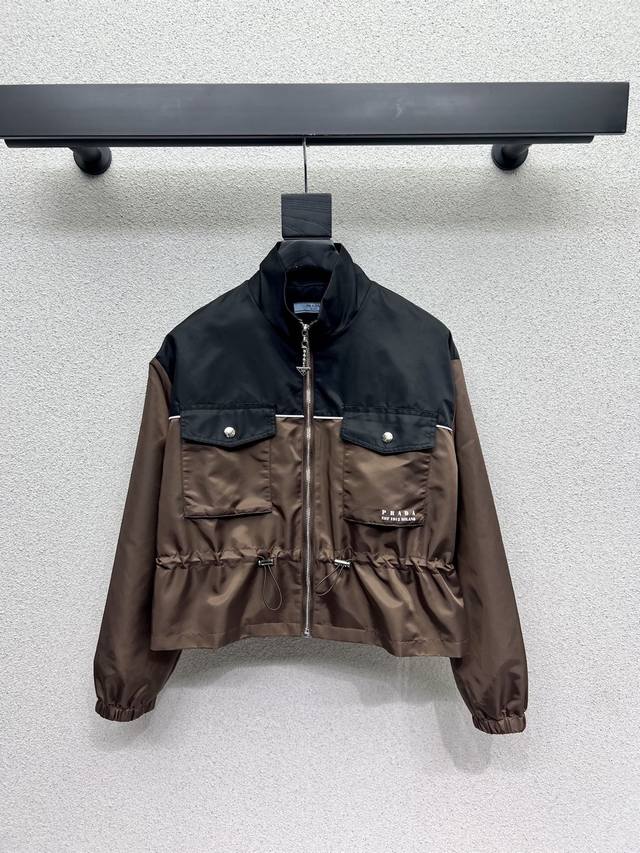 p's contrasting color waisted nylon jacket is a fashionable must-have item. It i