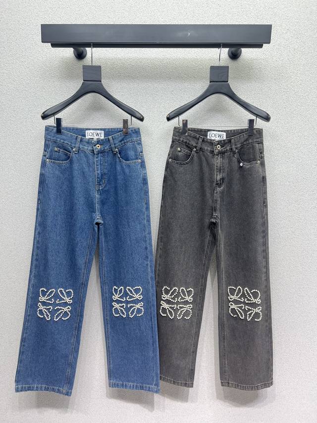 Loewe's knee-high pearl logo denim trousers feature a girly pearl logo design. A