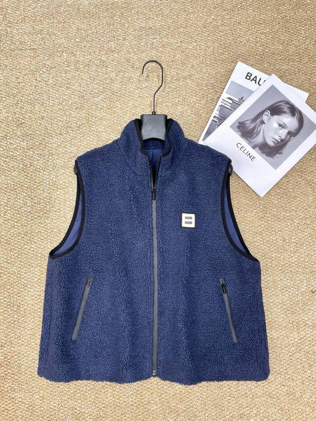 Miumiu's new coat features a soft, fluffy lining that feels like a cat, and the