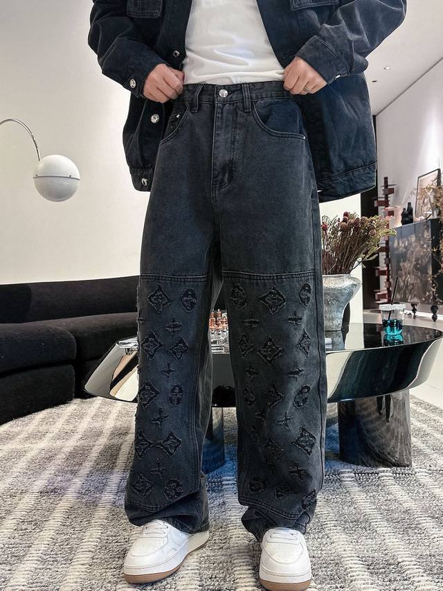Pants. New Lv hand-distressed distressed jeans with all-over logo print. Made en