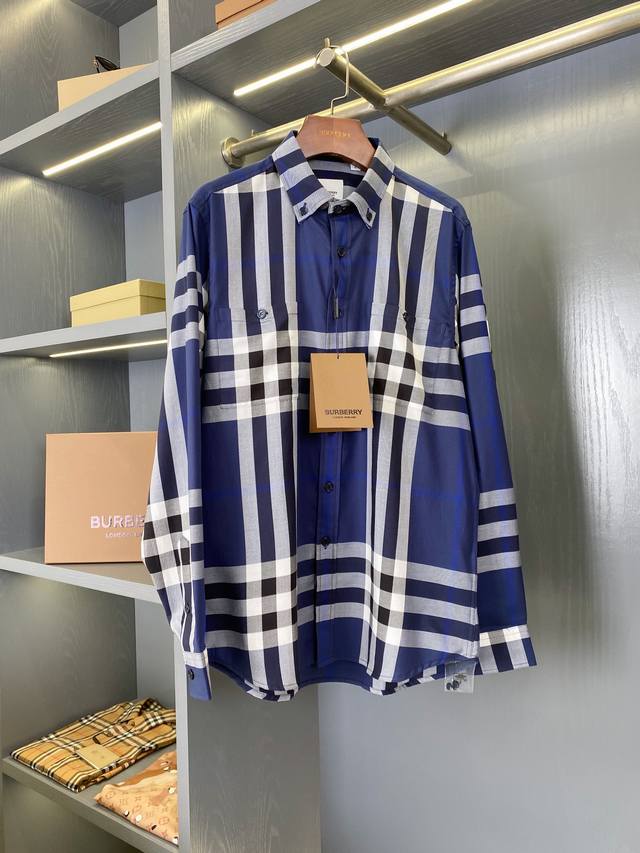 Double-pocket blue large-check fine cotton shirt. Available through Burberry's t