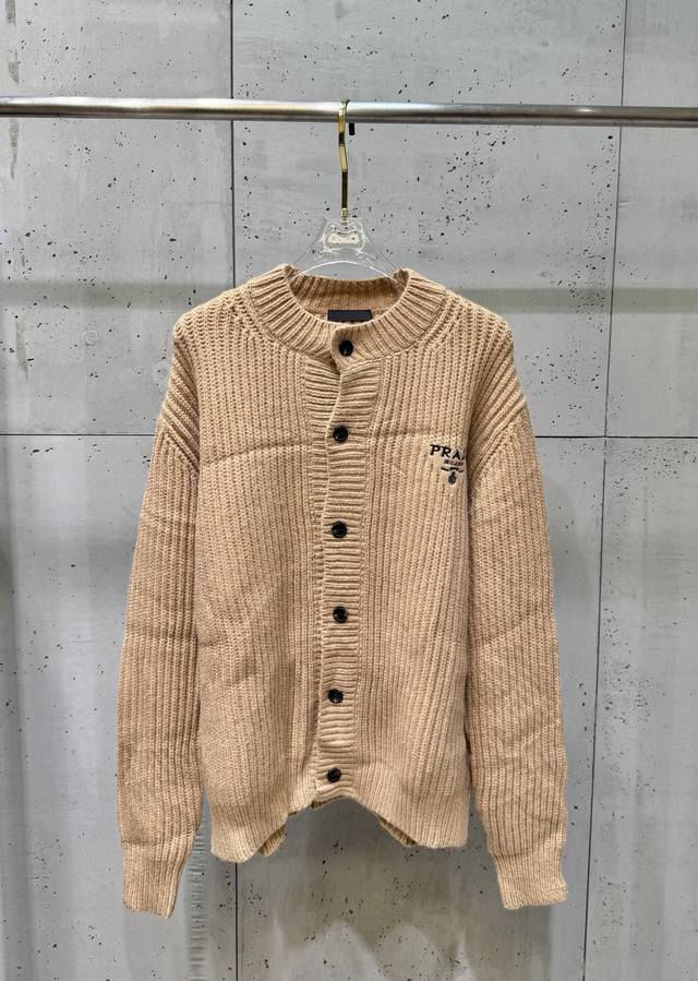Prada Fall/Winter Wool Knit Cardigan (Ddd) This sweater features embroidered det