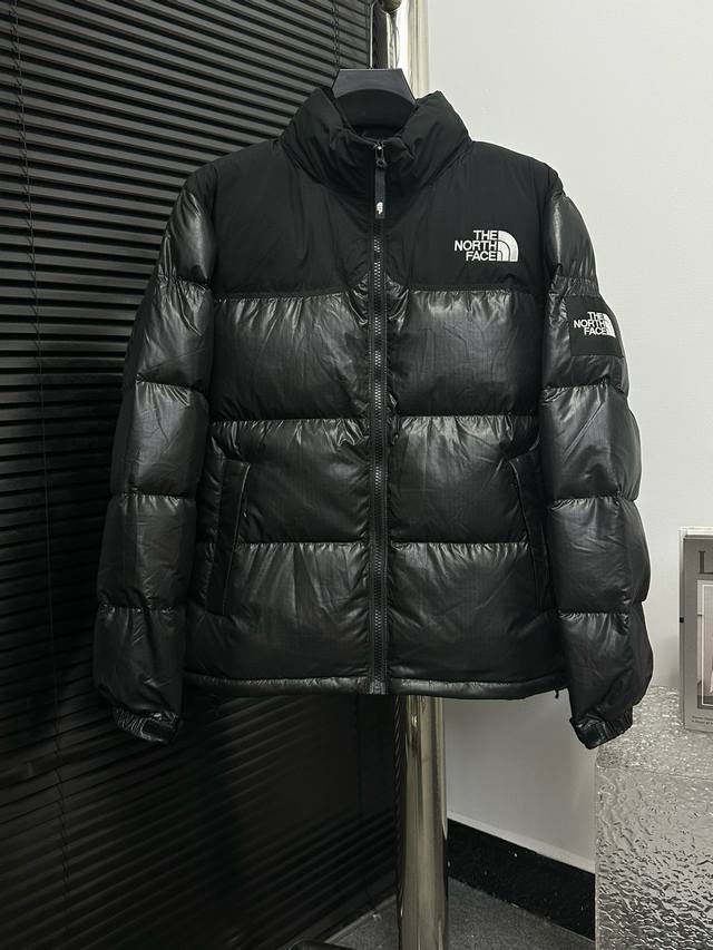 The Nuptse logo on the north side of the classic logo literally means the coldes