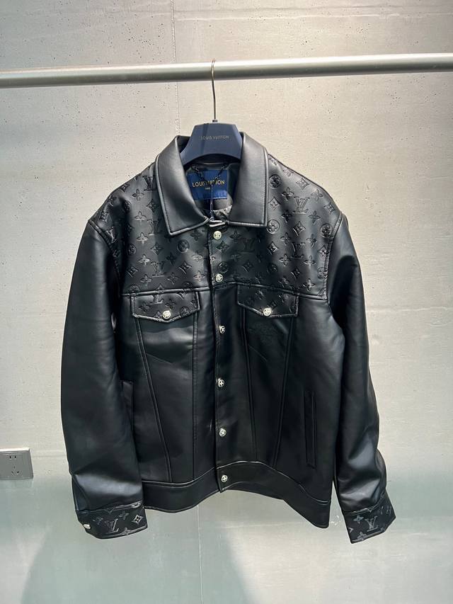 This leather jacket, crafted with Louis Vuitton's exquisite craftsmanship, featu