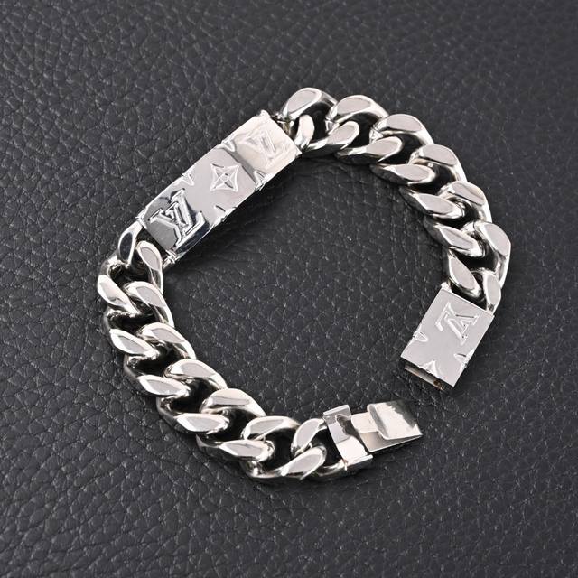 Louis Vutton Engraved Silver-Plated Bracelet. This silver-plated Monogram jewelr