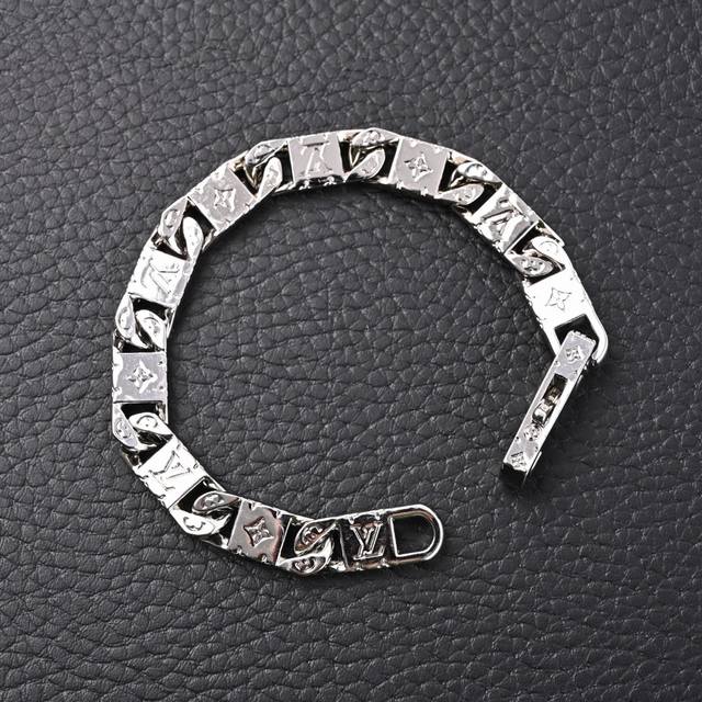 Louis Vuitton LV Monogram Tied Up Silver Cuban Bracelet. This bracelet features