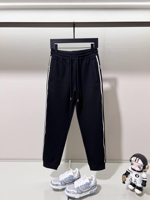 Louis Vuitton casual sweatpants suit. Features include beaded embroidered logo,