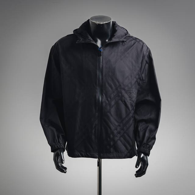 Burberry Bbr25Ss Equestrian Twill Hooded Jacket. The fabric is a highly durable