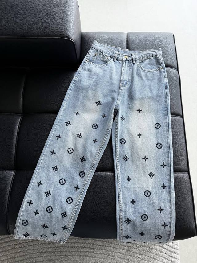 New Lv style denim trousers with 3D embroidered all-over logo lettering. Made en