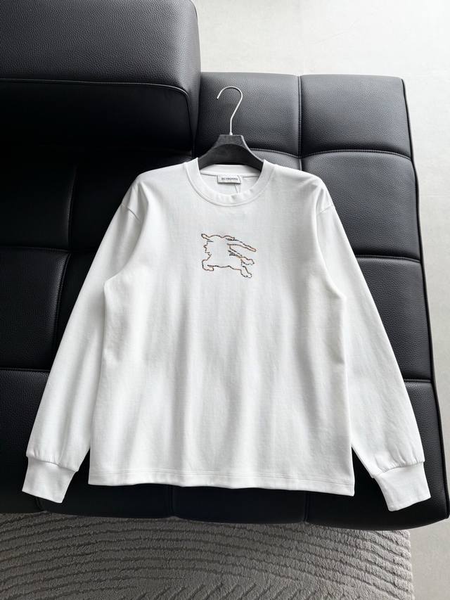 Clothing. Haute couture Burberry design. Features a logo with rhinestones on the