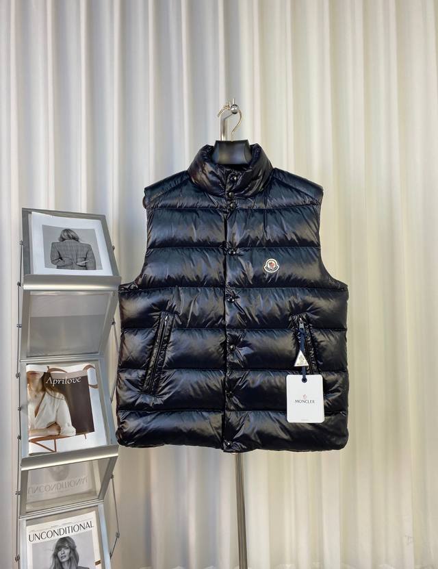 Moncler Down Vest This down vest is Moncler's reinterpretation of a classic piec