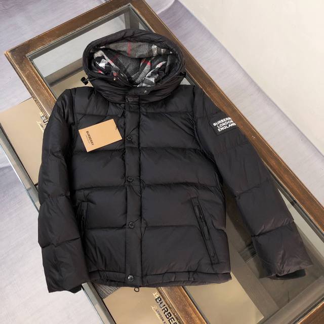 Burberry reversible black and red plaid down jacket with detachable sleeves. Thi