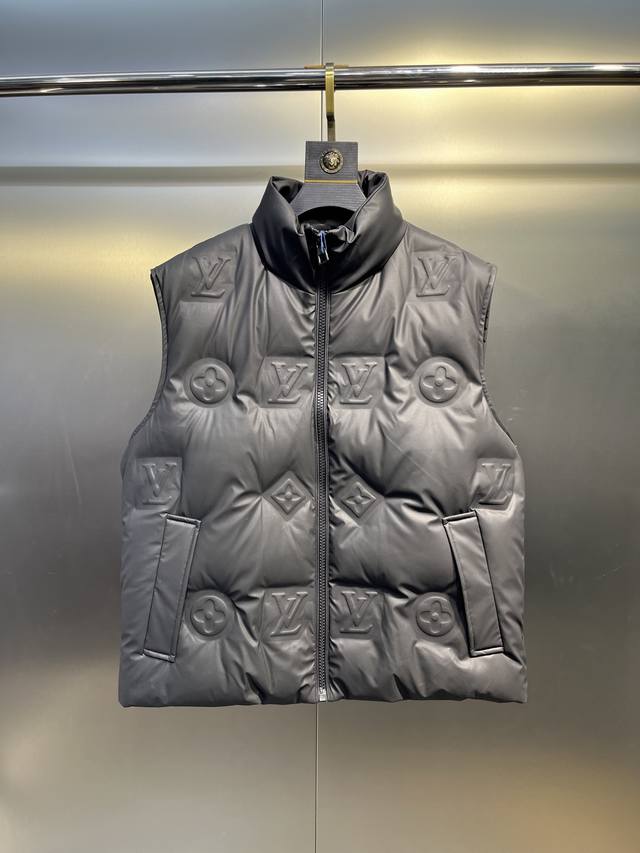 Louis Vuitton's classic and timeless short down vest system. A versatile piece s