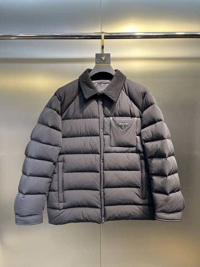 Prada New Jacquard Nylon Down Jacket with Metal Logo. This down jacket is made f