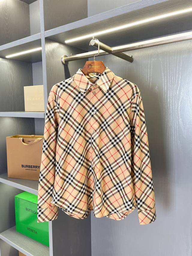 Classic checkered cotton shirt from Ddd, a top-tier Burberry channel. Priced at