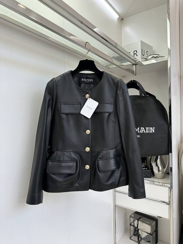 25 F This Balmain four-pocket French retro-style leather jacket with gold button