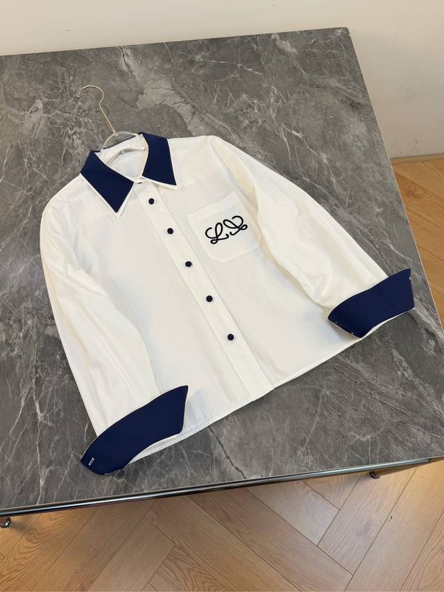 25 A perfect blend of new style and sophistication! This white shirt is absolute