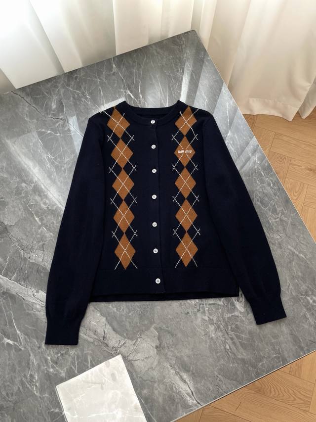 2025 New Miu Miu Diamond Quilted Preppy Knit Cardigan. This cardigan features a