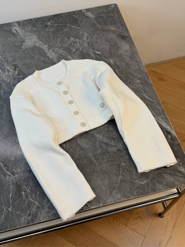 This new white short knit cardigan is so exquisite! The soft white color is clea