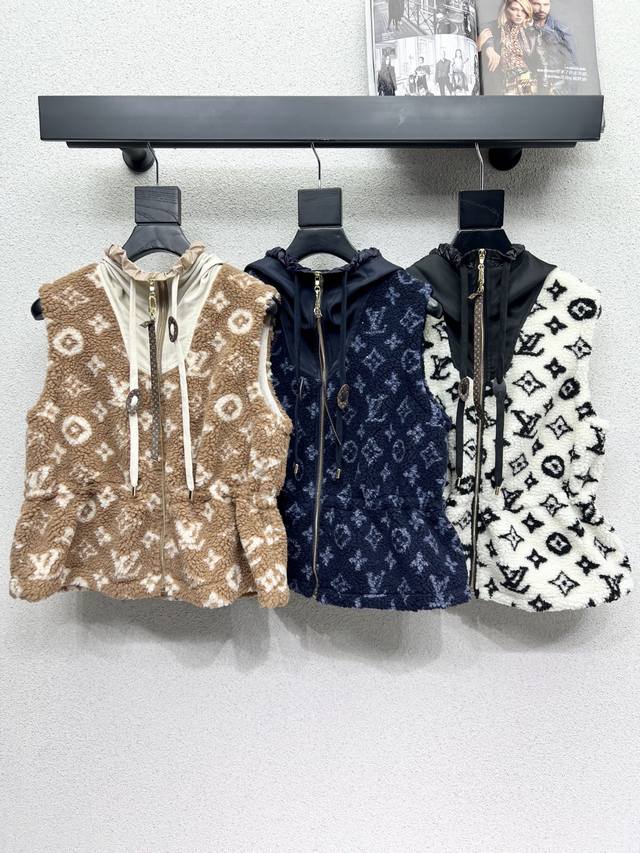 L's monogrammed eco-friendly lamb wool hooded vest is a must-have for fashionist