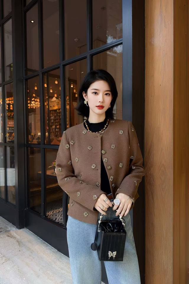 Jacket Ddd: A brown short jacket adorned with gold geometric beads and a retro b